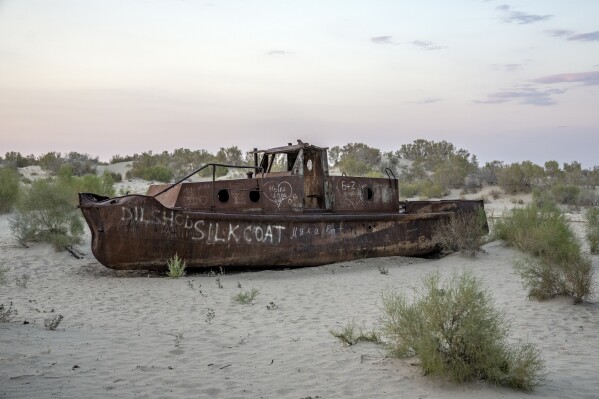 A rusting ship sits near a museum, outside Muynak, Uzbekistan, Sunday, June 25, 2023. (AP Photo/Ebrahim Noroozi)