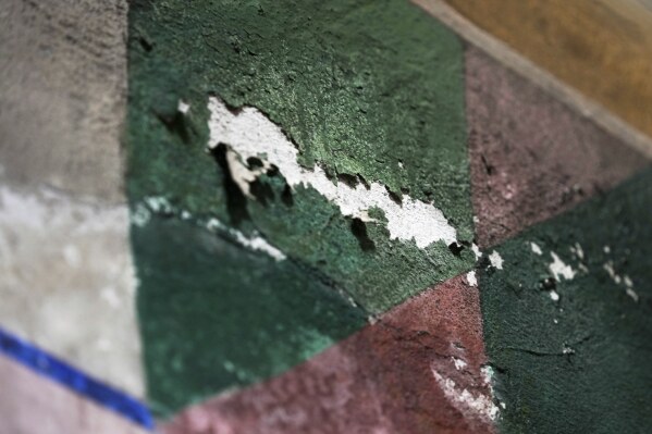 A damaged portion of a mural by Maxo Vanka is seen in St. Nicholas Croatian Catholic Church in Millvale, Pa., on Thursday, Jan 30, 2025. (AP Photo/Gene J. Puskar)