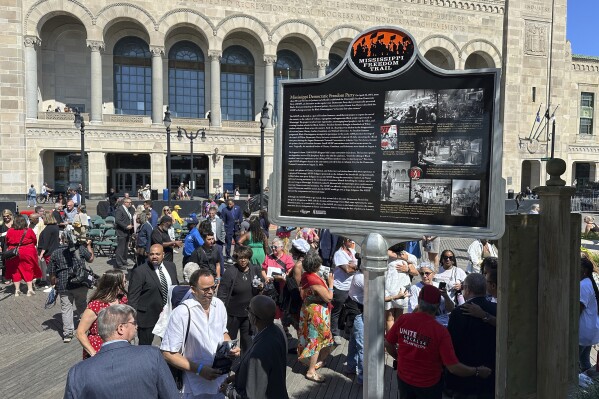 A newly unveiled Mississippi Freedom Trail marker on the boardwalk in front of Boardwalk Hall in Atlantic City, N.J., Tuesday, Aug. 20, 2024, commemorates Fannie Lou Hamer, a leader of the Mississippi Freedom Democratic Party, whose speech at the 1964 Democratic National Convention mesmerized the nation. (AP Photo/Ted Shaffrey)