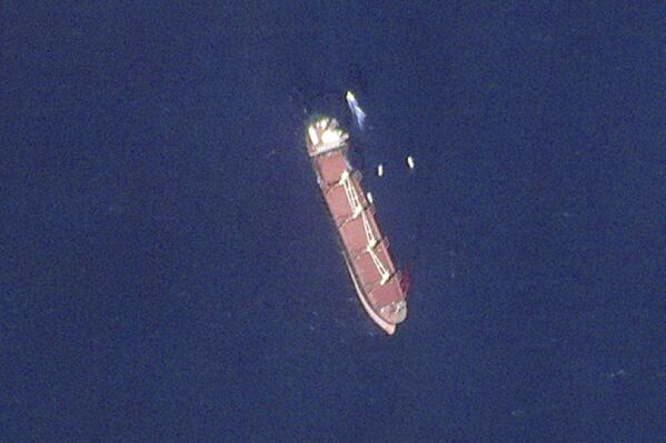 This satellite image taken by Planet Labs PBC shows the Belize-flagged ship Rubymar in the Red Sea on Wednesday, Feb. 28, 2024. The Rubymar, earlier attacked by Yemen's Houthi rebels, has sunk in the Red Sea after days of taking on water, officials said Saturday, March 2, 2024, the first vessel to be fully destroyed as part of their campaign over Israel's war against Hamas in the Gaza Strip. (Planet Labs PBC via AP)