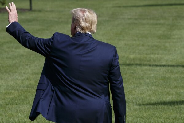 President Donald Trump waves as he crosses the South Lawn after speaking to the media about the testimony of former special counsel Robert Mueller to Congress, Wednesday, July 24, 2019, before boarding the Marine One helicopter at the White House in Washington. (AP Photo/Jacquelyn Martin)