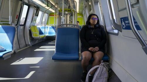 Sadaf Zahoor sits in a Bay Area Rapid Transit train Wednesday, June 7, 2023, in Oakland, Calif. Zahoor has used public transit her whole life and relies on it to get to work. (AP Photo/Godofredo A. Vásquez)