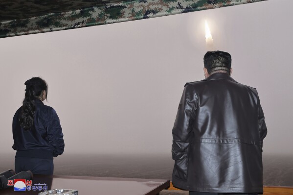 In this photo provided by the North Korean government, North Korean leader Kim Jong Un, right, and his daughter observe what it says a test launch of new intercontinental ballistic missile "Hwasong-19" at an undisclosed place in North Korea Thursday, Oct. 31, 2024. Independent journalists were not given access to cover the event depicted in this image distributed by the North Korean government. The content of this image is as provided and cannot be independently verified. Korean language watermark on image as provided by source reads: "KCNA" which is the abbreviation for Korean Central News Agency. (Korean Central News Agency/Korea News Service via AP)