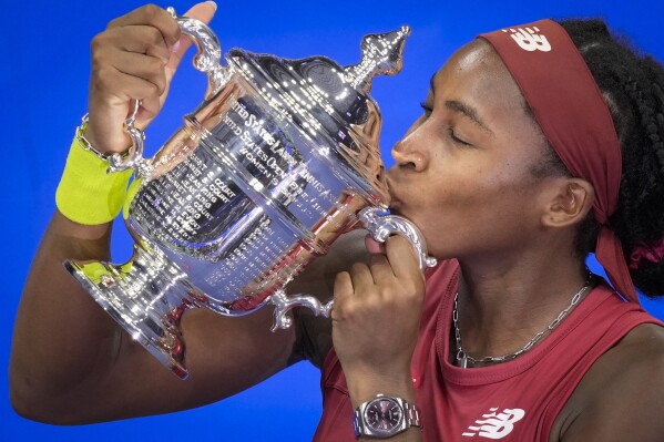 FILE - Coco Gauff, of the United States, poses for photographs after defeating Aryna Sabalenka, of Belarus, at the women's singles final of the U.S. Open tennis championships, Saturday, Sept. 9, 2023, in New York. (AP Photo/John Minchillo, File)