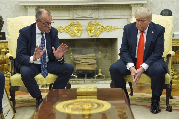 President Donald Trump, right, meets Germany's Chancellor Friedrich Merz in the Oval Office of the White House, Thursday, June 5, 2025, in Washington. (AP Photo/Evan Vucci)