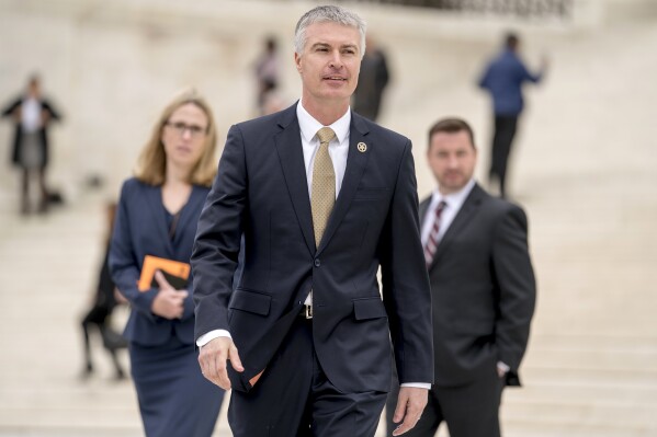 FILE - South Dakota Attorney General Marty Jackley leaves the U.S. Supreme Court, April 17, 2018, in Washington. Jackley announced late Thursday, Aug. 24, 2023, that his office is charging two inmates accused of attacking two state penitentiary officers with attempted murder and aggravated assault. (AP Photo/Andrew Harnik, File)