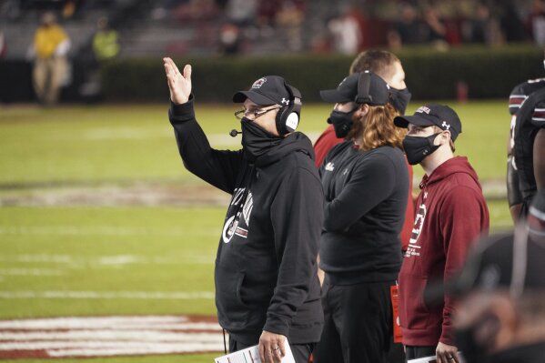 South Carolina interim head coach Mike Bobo reacts to an official's call during the first half of an NCAA college football game against Missouri, Saturday, Nov. 21, 2020, in Columbia, S.C. (AP Photo/Sean Rayford)