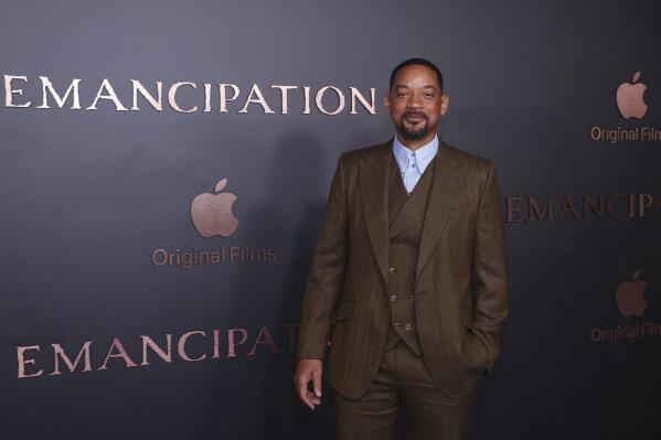 Will Smith poses for photographers upon arrival for the premiere of the film 'Emancipation' in London, Friday, Dec. 2, 2022. (Photo by Vianney Le Caer/Invision/AP)