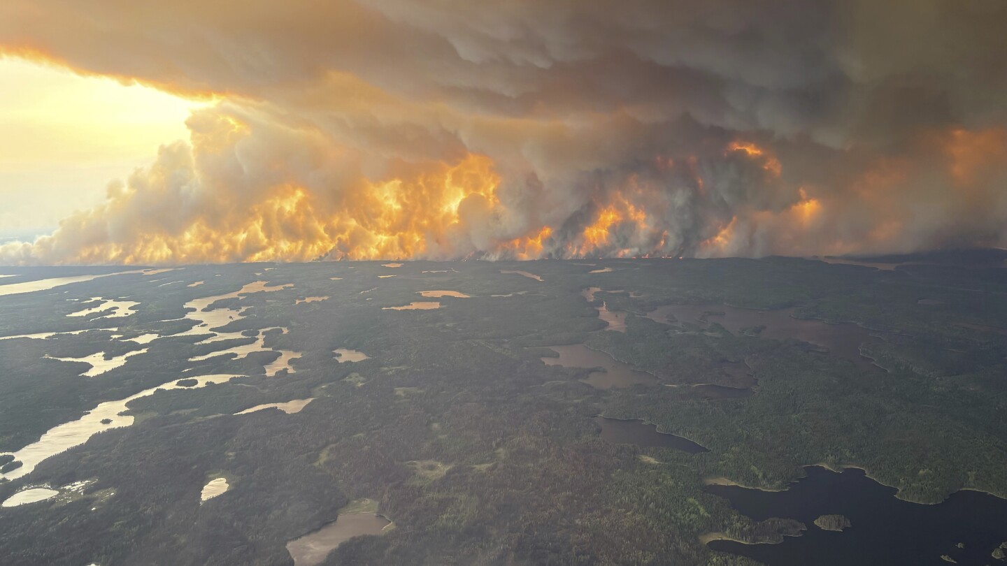 A Canadian prairie city virtually deserted as fires rage and thousands more evacuees expected