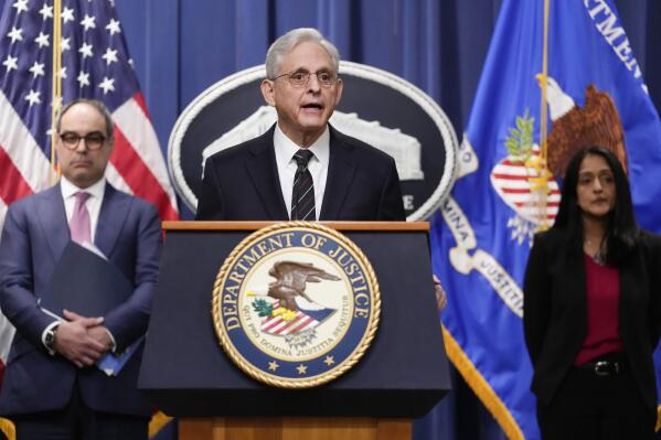 Attorney General Merrick Garland, joined by Associate Attorney General Vanita Gupta and Assistant Attorney General Jonathan Kanter of the Justice Department's Antitrust Division, speaks at the Department of Justice in Washington, Tuesday, Jan. 24, 2023. The Justice Department and several states have sued Google, alleging that its dominance in digital advertising harms competition. (AP Photo/Carolyn Kaster)