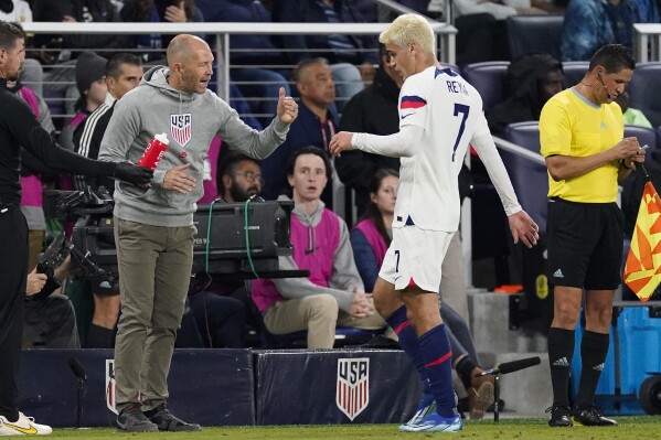 United States head coach Gregg Berhalter talks with midfielder Gio Reyna (7) during the first half of an international friendly soccer match against Ghana, Tuesday, Oct. 17, 2023, in Nashville, Tenn. (AP Photo/George Walker IV)