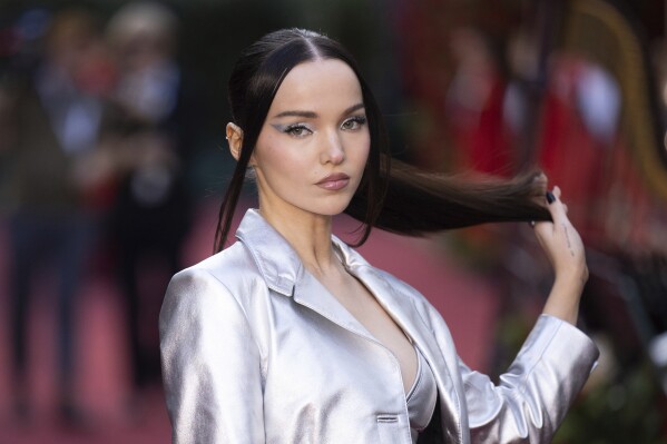 FILE - Dove Cameron poses for photographers upon arrival at the Vogue World event on Sept. 14, 2023 in London. Cameron's latest album “Alchemical: Volume 1," releases Dec. 1. (Vianney Le Caer/Invision/AP, File)