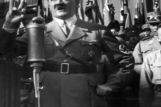 FILE - An undated file picture shows the leader of the National Socialists Adolf Hitler, gesturing during a speech. A prominent European Jewish organization is criticizing a Munich auction house’s decision to sell several of Nazi dictator Adolf Hitler’s handwritten speeches, saying it “defies logic, decency and humanity” to put them on the market(dpa via AP, file)