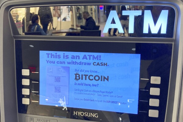 File - Bitcoin is for sale at an Automated Teller Machine at the Westfield Garden State Plaza shopping mall in Paramus, New Jersey, on March 13, 2023. The world's largest cryptocurrency soared to almost $35,000 this week, marking its highest value in nearly 18 months. (AP Photo/Ted Shaffrey, File)