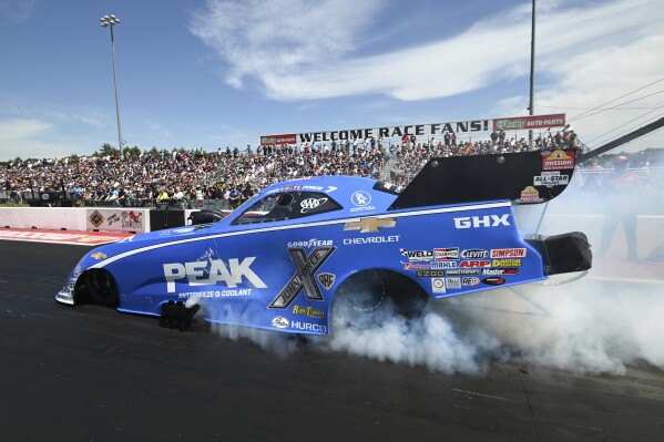 In this photo provided by the NHRA, Funny Car great John Force earned his 157th career NHRA race on Sunday, June 2, 2024, at the NHRA New England Nationals at New England Dragway, in Epping, N.H. (Marc Gewertz/NHRA via AP)