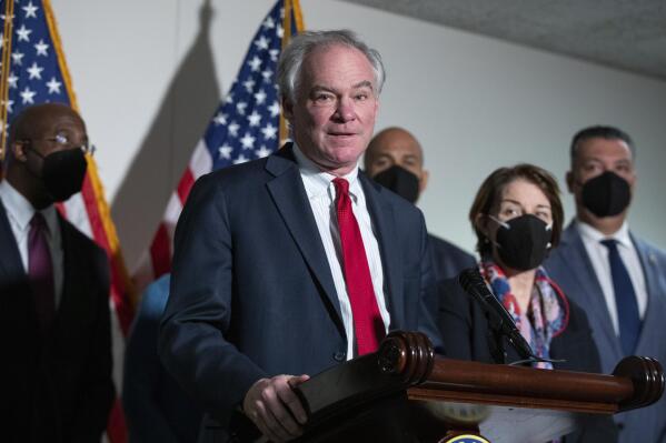 FILE - Sen. Tim Kaine, D-Va., speaks to reporters alongside Sen. Raphael Warnock, D-Ga., Sen. Cory Booker, D-N.J., and Sen. Amy Klobuchar, D-Minn., and Sen. Alex Padilla, D-Calif., during a press conference regarding the Democratic party's shift to focus on voting rights at the Capitol in Washington, Jan. 18, 2022. Nearly two years after getting COVID-19, Sen. Kaine says he still has mild symptoms. Kaine joined fellow Democratic senators Edward Markey of Massachusetts and Tammy Duckworth of Illinois in introducing a bill Wednesday, March 3, 2022, to fund research aimed at better understanding long COVID-19. (AP Photo/Amanda Andrade-Rhoades, File)