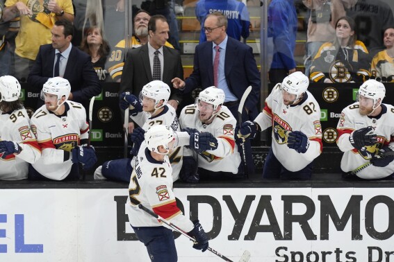 Florida Panthers' Gustav Forsling (42) celebrates after his go-ahead goal with teammates on the bench, including Vladimir Tarasenko (10), during the third period in Game 6 of an NHL hockey Stanley Cup second-round playoff series against the Boston Bruins, Friday, May 17, 2024, in Boston. (AP Photo/Michael Dwyer)