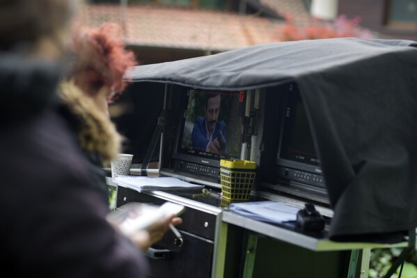 A production team is filming scenes of a Turkish drama in Istanbul Turkey, Tuesday, April 30, 2024. (AP Photo/Khalil Hamra)