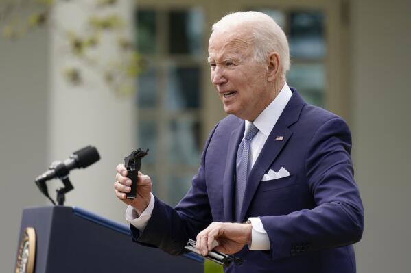 President Joe Biden holds pieces of a 9mm pistol as he speaks in the Rose Garden of the White House in Washington, Monday, April 11, 2022. Biden announced a final version of the administration’s ghost gun rule, which comes with the White House and the Justice Department under growing pressure to crack down on gun deaths. (AP Photo/Carolyn Kaster)