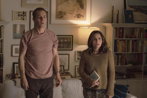 This image released by A24 shows Tobias Menzies, left, and Julia Louis-Dreyfus in a scene from "You Hurt My Feelings." (Jeong Park/A24 via AP)