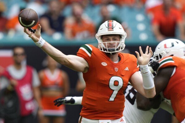 Tyler Van Dyke throws 5 TD passes in Miami's statement 48-33 win over No.  23 Texas A&M | AP News
