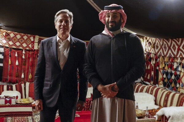 U.S. Secretary of State Antony Blinken meets with Saudi Crown Prince Mohammed bin Salman during his week-long trip aimed at calming tensions across the Middle East, in Al Ula, Saudi Arabia, Monday, Jan. 8, 2024. (Evelyn Hockstein/Pool Photo via AP)