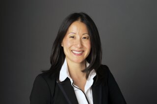 
              This 2019 photo provided by USA Gymnastics shows Li Li Leung. USA Gymnastics is turning to NBA executive Li Li Leung to help turn the embattled program around. The organization named Leung as its new president and chief executive officer on Tuesday, Feb. 19, 2019,  as it fights to retain its status as the national governing body for the sport after the Larry Nassar sexual abuse scandal. Leung served as vice president of global partnerships for the NBA. She arrives as USA Gymnastics attempts to fend off decertification from the United States Olympic Committee. (Wendy Barrows Photography/USA Gymnastics via AP)
            