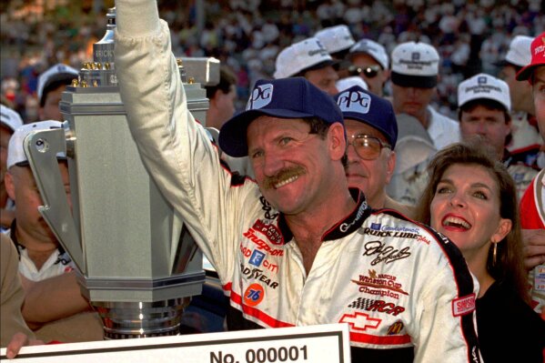 FILE -  In this Aug. 5, 1995 file photo, NASCAR driver Dale Earnhardt of Mooresville, N.C., gives a "thumbs up" to the crowd from victory lante after winning the Brickyard 400 auto race at the Indianapolis Motor Speedway in Indianapolis. (AP Photo/Tom Strattman, File)