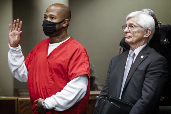 Hernandez Govan, left, the third suspect arrested in the murder of Memphis rapper Young Dolph,  along with his lawyer William Massey, right, is arraigned in Judge Lee Coffee's courtroom on Thursday, Nov. 17, 2022. (Mark Weber/Daily Memphian via AP)