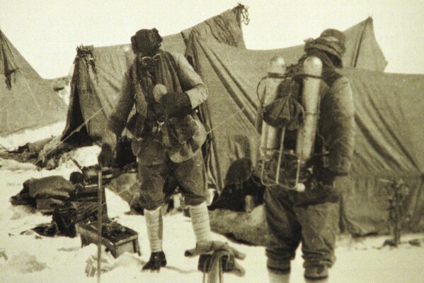 FILE - British mountaineers George Mallory is seen with Andrew Irvine at the base camp in Nepal, both members of the Mount Everest expeditions 1922 and 1924, as they get ready to climb the peak of Mount Everest June 1924. It is the last image of the men before they disappeared in the mountain. George Mallory’s final letter to his wife before he vanished on Mount Everest a century ago tried to ease her worries though he said his chances of reaching the world’s highest peak were “50 to 1 against us.” (AP Photo, File)