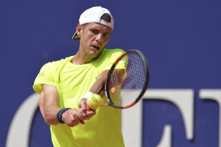 France's Paul-Henri Mathieu returns the ball to Germany's Philipp Kohlschreiber during their final match at the Generali Open tennis tournament in Kitzbuehel, Austria, Saturday, Aug. 8, 2015. Paul-Henri Mathieu was named France's Davis Cup captain on Friday and he will also lead the men's national tennis team at next year's Olympics in Paris. (AP Photo/Kerstin Joensson)