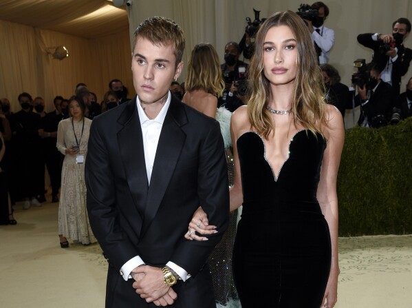 FILE - Justin Bieber, left, and Hailey Bieber attend The Metropolitan Museum of Art's Costume Institute benefit gala on Sept. 13, 2021, in New York. Justin Bieber and wife Hailey are expecting their first child together. (Photo by Evan Agostini/Invision/AP, File)