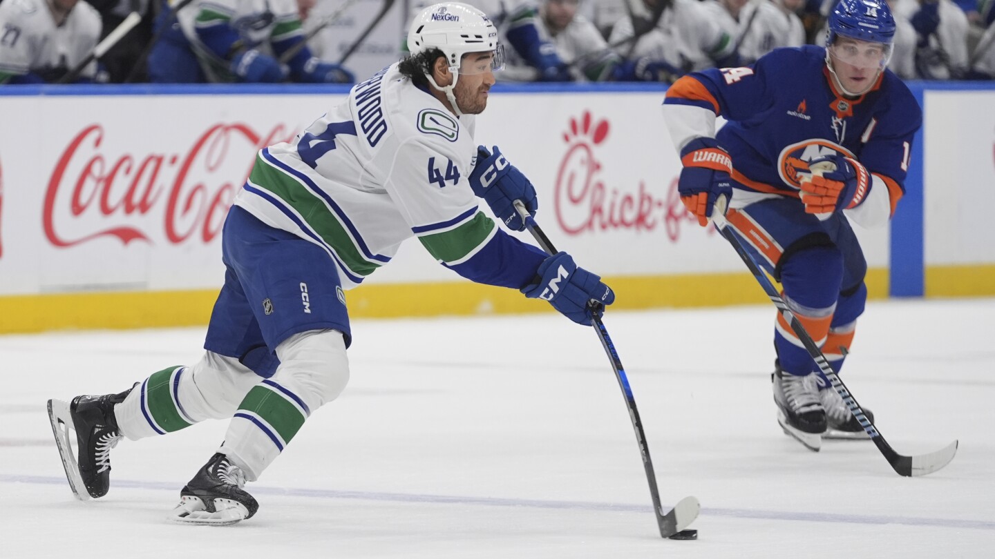 Sherwood and Demko lead Canucks to 5-2 win over Islanders