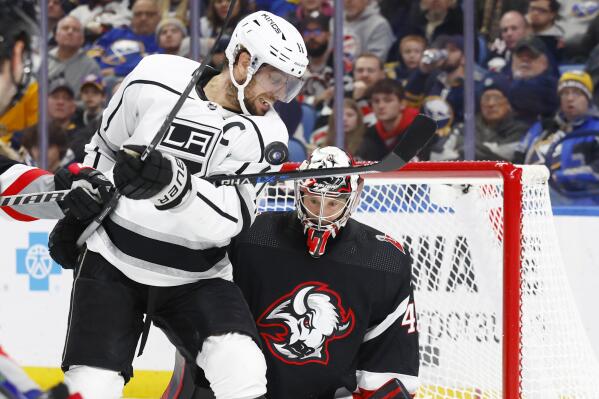 Los Angeles Kings center Anze Kopitar (11) attempts to tip the puck past Buffalo Sabres goaltender Craig Anderson (41) during the second period of an NHL hockey game, Tuesday, Dec. 13, 2022, in Buffalo, N.Y. (AP Photo/Jeffrey T. Barnes)