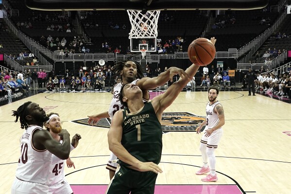 Colorado State forward Joel Scott (1) shoots under pressure from Boston College forward Devin McGlockton during the second half of an NCAA college basketball game Wednesday, Nov. 22, 2023, in Kansas City, Mo. Colorado State won 86-74. (AP Photo/Charlie Riedel)