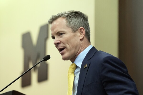 Dusty May is introduced as the University of Michigan NCAA college basketball head coach, Tuesday, March 26, 2024, in Ann Arbor, Mich. (AP Photo/Carlos Osorio)
