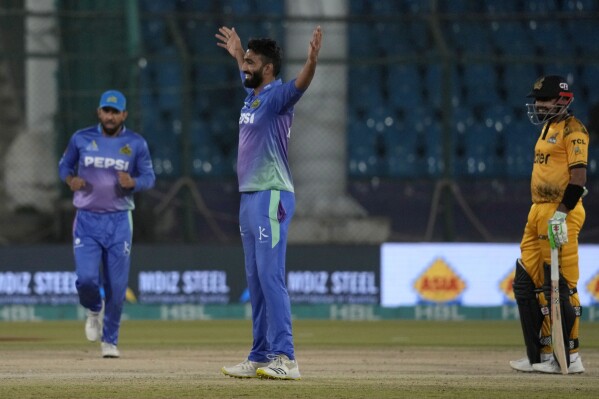 Multan Sultans' Usama Mir, center, celebrates after taking the wicket during the Pakistan Super League T20 cricket qualifier match between Peshawar Zalmi and Multan Sultans, in Karachi, Pakistan, Thursday, March 14, 2024. (AP Photo/Anjum Naveed)