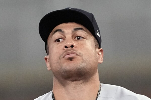 FILE - New York Yankees' hitter Giancarlo Stanton is shown during a baseball game against the Atlanta Braves, Wednesday, Aug. 16, 2023, in Atlanta. At 34, Stanton realizes the repercussions of another subpar season, especially after Yankees acquired Juan Soto and Trent Grisham during the offseason. (APPhoto/John Bazemore, File)