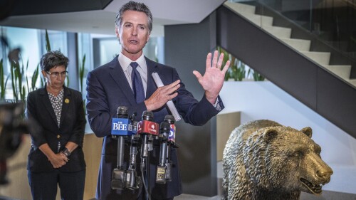 California Gov. Gavin Newsom gestures during a press conference at his swing space office after meeting a coalition of behavioral health reform leaders and local elected officials in Sacramento, Calif., on Wednesday, July 12, 2023. Newsom stepped in Wednesday to help revive a bill that would increase penalties for child trafficking. Newsom told reporters he was surprised the bill failed to pass an Assembly committee. (Hector Amezcua/The Sacramento Bee via AP)