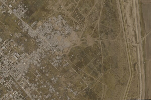 This satellite photo from Planet Labs PBC shows the town of Khuzaa, east of Khan Younis in the southern Gaza Strip in March, 2025. (Planet Labs PBC via AP)