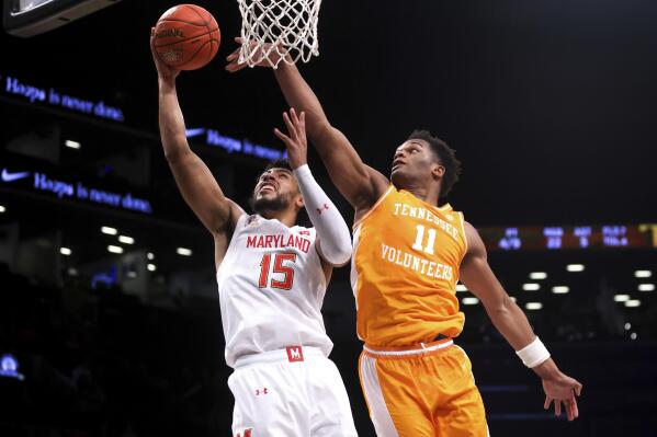 Tennessee forward Tobe Awaka (11) attempts to block Maryland forward Patrick Emilien (15) during the first half of an NCAA college basketball game in the Basketball Hall of Fame Invitational, Sunday, Dec. 11, 2022, in New York. (AP Photo/Julia Nikhinson)
