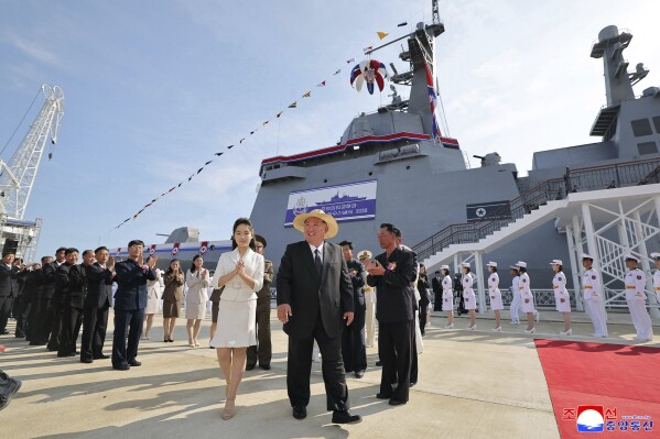 In this photo provided by the North Korean government, its leader Kim Jong Un, center, and his daughter attend a launch ceremony of a destroyer named Kang Kon at the Rajin shipyard in Rason, North Korea, Thursday, June 12, 2025. Independent journalists were not given access to cover the event depicted in this image distributed by the North Korean government. The content of this image is as provided and cannot be independently verified. Korean language watermark on image as provided by source reads: "KCNA" which is the abbreviation for Korean Central News Agency. (Korean Central News Agency/Korea News Service via AP)