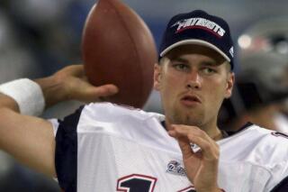 FILE - New England Patriots backup quarterback Tom Brady warms up on the sidelines before the game against the Detroit Lions at the Silverdome in Pontiac, Mich., Friday, Aug. 4, 2000. (AP Photo/Carlos Osorio, File)