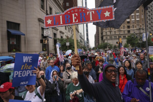 Demonstrators march during the "No Kings" protest, Saturday, June 14, 2025, in Philadelphia. (AP Photo/Yuki Iwamura)