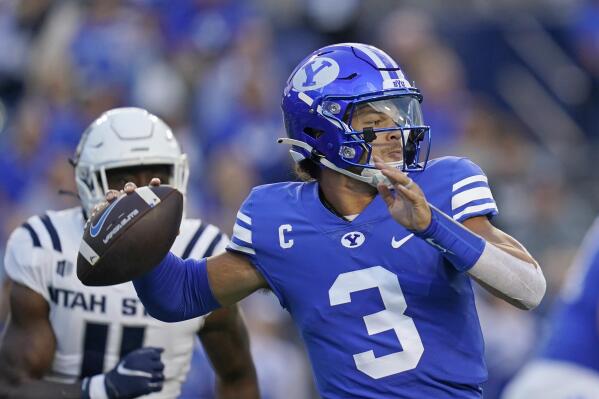 BYU quarterback Jaren Hall (3) throws a pass during the first half of the team's NCAA college football game against Utah State on Thursday, Sept. 29, 2022, in Provo, Utah. (AP Photo/Rick Bowmer)