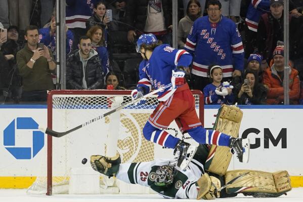 New York Rangers left wing Artemi Panarin (10) scores the winning goal against Minnesota Wild goaltender Marc-Andre Fleury (29) during the shootout of an NHL hockey game, Tuesday, Jan. 10, 2023, at Madison Square Garden in New York. The Rangers won 4-3. (AP Photo/Mary Altaffer)