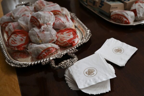 A the table full of fast food in the State Dining Room of the White House in Washington, Monday, Jan. 14, 2019, is ready for guests attending a reception for the Clemson Tigers. (AP Photo/Susan Walsh)
