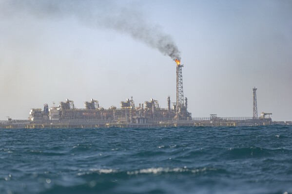 View of the Grand Tortue Ahmeyim (GTA) natural gas extraction platform located 8km from the beach Off the coast of Saint-Louis, Senegal, Thursday, March 13, 2025. (AP Photo/Sylvain Cherkaoui)