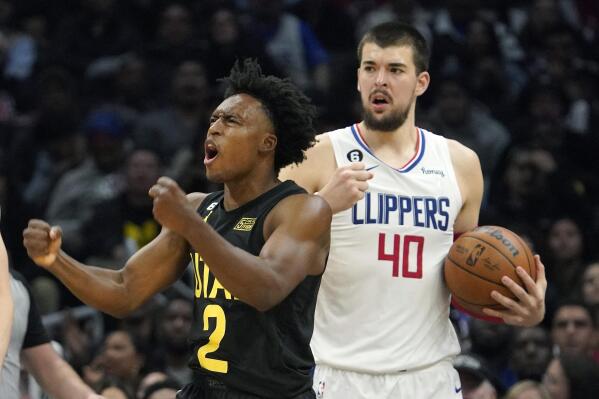 Utah Jazz guard Collin Sexton , left, celebrates after scoring as Los Angeles Clippers center Ivica Zubac stands in the background during the second half of an NBA basketball game Sunday, Nov. 6, 2022, in Los Angeles. (AP Photo/Mark J. Terrill)