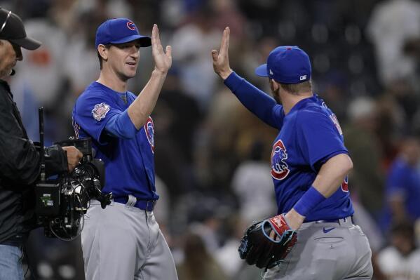 Chicago Cubs starting pitcher Kyle Hendricks, left, celebrates with left fielder Ian Happ after the Cubs defeated the San Diego Padres 6-0 in a baseball game Monday, May 9, 2022, in San Diego. (AP Photo/Gregory Bull)